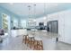 Bright kitchen featuring white cabinets, granite countertops, and stainless steel appliances at 431 Kettle Harbor Dr, Placida, FL 33946