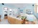 Bright living room with water views, comfortable seating, and coastal decor at 431 Kettle Harbor Dr, Placida, FL 33946