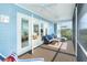 Relaxing screened porch with comfy seating and views of the living area at 431 Kettle Harbor Dr, Placida, FL 33946