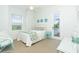 Guest bedroom with full-size bed and private balcony access at 431 Kettle Harbor Dr, Placida, FL 33946