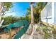 Two kayaks stored in a backyard, near the water at 431 Kettle Harbor Dr, Placida, FL 33946