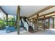 Under-house area with stairs, golf cart, and storage; ample space for parking and storage at 431 Kettle Harbor Dr, Placida, FL 33946