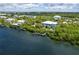 Aerial view of a waterfront home with a private dock and pool at 431 Kettle Harbor Dr, Placida, FL 33946