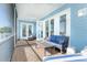 Relaxing screened porch with outdoor seating, overlooking a tranquil waterfront view at 431 Kettle Harbor Dr, Placida, FL 33946