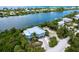 Elevated view of waterfront home with private pool and boat dock at 431 Kettle Harbor Dr, Placida, FL 33946