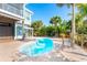 Kidney-shaped pool with brick patio and tropical landscaping at 431 Kettle Harbor Dr, Placida, FL 33946