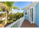 Private deck with wooden flooring and white railings, offering tranquil views of surrounding landscape at 431 Kettle Harbor Dr, Placida, FL 33946