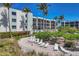 Inviting pool area with lounge chairs and lush landscaping at 5700 Gulf Shores Dr # B134, Boca Grande, FL 33921