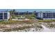 Aerial view of condo complex, showing beach access and pool at 5700 Gulf Shores Dr # B134, Boca Grande, FL 33921