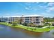 Multi-unit community with water views and lush landscaping at 8403 Placida Rd # 301, Placida, FL 33946