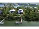 Waterfront property with private dock and lush landscaping at 201 Kettle Harbor Dr, Placida, FL 33946