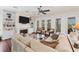 Living room features a fireplace, built-in shelving, and water views at 201 Kettle Harbor Dr, Placida, FL 33946