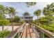 Two-story waterfront home with private dock and lush landscaping at 201 Kettle Harbor Dr, Placida, FL 33946