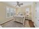 Cozy bedroom with a white bed frame and plantation shutters at 201 Kettle Harbor Dr, Placida, FL 33946