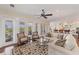 Living room with access to a patio and water view at 201 Kettle Harbor Dr, Placida, FL 33946