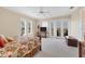 Main bedroom with king-size bed, access to a balcony, and plenty of space at 201 Kettle Harbor Dr, Placida, FL 33946