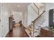 Hardwood floors and white walls in a spacious entry hall with staircase at 201 Kettle Harbor Dr, Placida, FL 33946