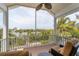 Relaxing screened porch overlooking the water with comfortable seating at 201 Kettle Harbor Dr, Placida, FL 33946