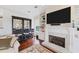 Home bar with glass-front cabinets and seating for three at 201 Kettle Harbor Dr, Placida, FL 33946