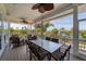 Relaxing screened porch with outdoor dining and seating area at 201 Kettle Harbor Dr, Placida, FL 33946