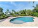 Relaxing freeform pool with a sun shelf and plenty of space for lounging at 201 Kettle Harbor Dr, Placida, FL 33946