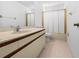 Bathroom showcasing a vanity with a sink, a toilet, and a mirror at 104 Park Forest Blvd, Englewood, FL 34223