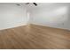 Spacious bedroom with hardwood floors, bright light, and a view at 104 Park Forest Blvd, Englewood, FL 34223