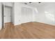 Bedroom featuring hardwood floors, a closet and neutral-colored walls at 104 Park Forest Blvd, Englewood, FL 34223