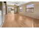 Well-lit sunroom with wood-look paneling, fan and durable flooring at 104 Park Forest Blvd, Englewood, FL 34223