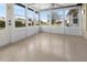 Bright Florida room features lots of windows and access to the backyard at 104 Park Forest Blvd, Englewood, FL 34223