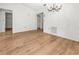 Living room area with sleek floors, modern lighting and neutral wall paint at 104 Park Forest Blvd, Englewood, FL 34223