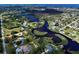 Aerial view showing home's location near water at 110 S Oxford Dr, Englewood, FL 34223
