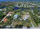 Aerial view showcasing home's location and waterfront access at 110 S Oxford Dr, Englewood, FL 34223
