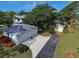 Property features a large two-car garage and a detached garage at 110 S Oxford Dr, Englewood, FL 34223
