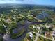 Waterfront property with scenic canal views and lush landscape at 110 S Oxford Dr, Englewood, FL 34223