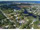Aerial view showing home, lot, and surrounding area at 110 S Oxford Dr, Englewood, FL 34223