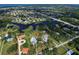 Aerial view showing home, lot, and surrounding area at 110 S Oxford Dr, Englewood, FL 34223