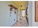 Private back patio with tiled flooring and access from multiple rooms at 110 S Oxford Dr, Englewood, FL 34223