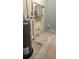 Unfinished bathroom with plumbing, water heater and a sink at 110 S Oxford Dr, Englewood, FL 34223