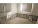 Unfinished bedroom with exposed wall framing and flooring at 110 S Oxford Dr, Englewood, FL 34223