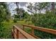 Charming wooden bridge leads to a peaceful backyard at 110 S Oxford Dr, Englewood, FL 34223