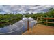 Private wooden dock offering serene waterfront views at 110 S Oxford Dr, Englewood, FL 34223