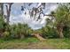 Wooden dock provides access to the tranquil waterway at 110 S Oxford Dr, Englewood, FL 34223