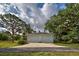 Detached two-car garage with concrete driveway at 110 S Oxford Dr, Englewood, FL 34223