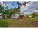 Charming guest house with a well-manicured lawn at 110 S Oxford Dr, Englewood, FL 34223