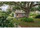 Quaint guest house nestled under a large oak tree at 110 S Oxford Dr, Englewood, FL 34223