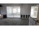 Room undergoing renovation with exposed wall studs and new flooring at 110 S Oxford Dr, Englewood, FL 34223