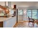 Updated kitchen with granite countertops and stainless steel appliances at 110 S Oxford Dr, Englewood, FL 34223