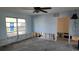 Unfinished living room with exposed framing and flooring at 110 S Oxford Dr, Englewood, FL 34223