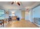 Light and airy living room with wood floors and access to patio at 110 S Oxford Dr, Englewood, FL 34223